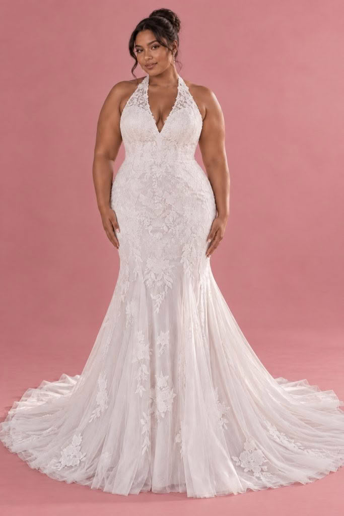 Sherri Curve wedding dress, front view against a dusty pink studio background