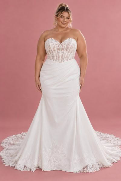 Saskia wedding dress, front view against a dusty pink studio background